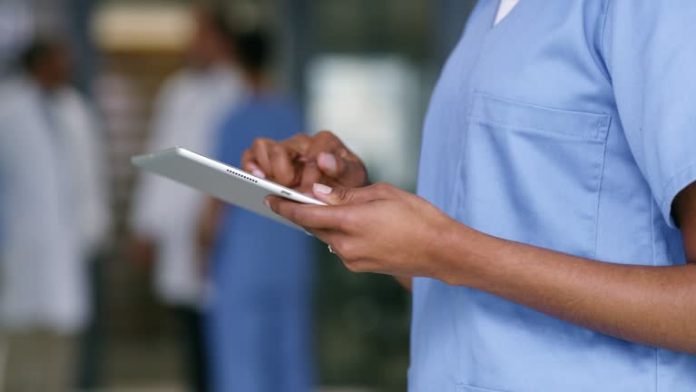 4k video footage of a nurse using a digital tablet in a hospital